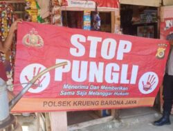 Personel Polsek Krueng Barona Jaya Sosialisasi STOP Pungli