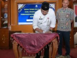 Pj Gubernur Safrizal Tanda Tangani Serah Terima Aset PON XXI